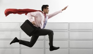 Businessman Wearing Cape --- Image by © Royalty-Free/Corbis
